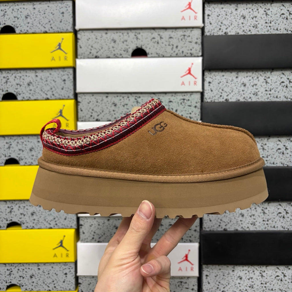 UGG Tazz Platform Slipper – Suede Mule with Shearling Lining, Red & Gold Braided Collar Trim, Red Pull Tab & Chunky Platform Sole in Chestnut