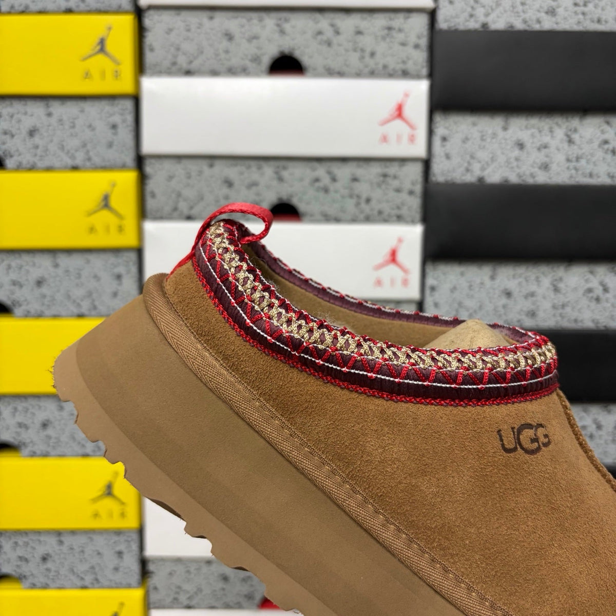 UGG Tazz Platform Slipper – Suede Mule with Shearling Lining, Red & Gold Braided Collar Trim, Red Pull Tab & Chunky Platform Sole in Chestnut